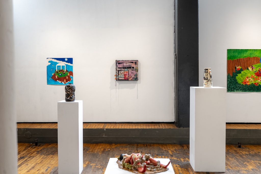 Image: Installation View, Eden Through a Glory Hole, 2025, Chicago Art Department. Two vessels—one dark, one light—sit on tall, white pedestals. They flank two works hung on the wall and an abstracted red, brown, and beige sculpture positioned closer to the floor. Photo: Mikey Mosher. Courtesy of Tali Halpern.