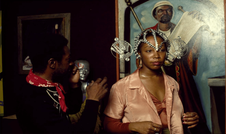 Image: Yaounde Olu (pictured left) models artist Edfu Kinginga ( (pictured right) elaborate metal headpiece during an event by the artist at Osun. Image courtesy of Yaounde Olu.