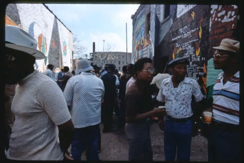 Image: A crowd is gathered outside of Universal Alley. Image courtesy of the Library of Congress.