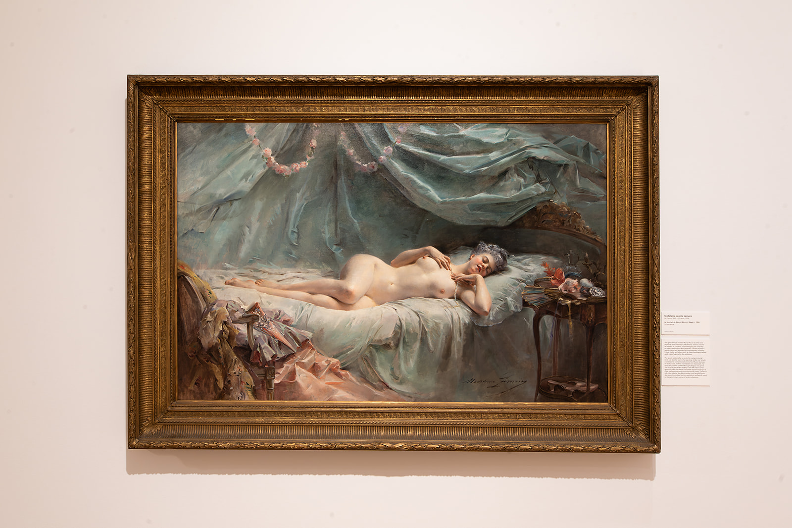 Image: Installation view of The First Homosexuals: The Birth of a New Identity, 1869-1939, at Wrightwood 659, 2025. An oil painting of a nude female figure lying on a bed is presented in a gilded frame. Photo courtesy of Daniel Eggert (@DesigningDan).