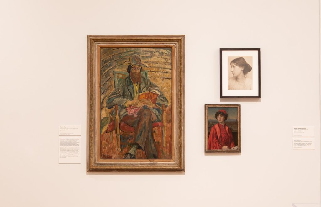 Image: Installation view of The First Homosexuals: The Birth of a New Identity, 1869-1939, at Wrightwood 659, 2025. Three portraits are presented on a gallery wall: a man reading in a chair, a platinum print profile view of a woman with an updo, and a woman wearing crimson robes. Photo courtesy of Daniel Eggert (@DesigningDan).