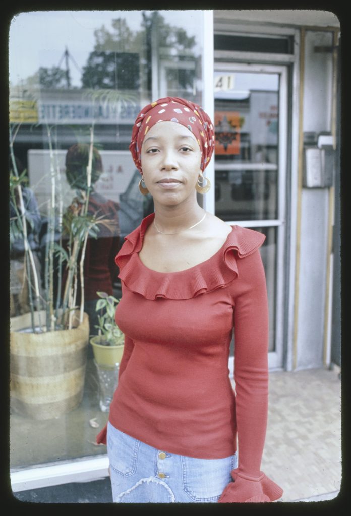 Image (left): Image: Yaoundé Olu, uniphysicist, photographed in front of Oşun Studio, 2541 E. 75th St., Chicago, Illinois. Image by Jonas Dovydenas for the Library of Congress' Chicago Ethnic Arts Project. 