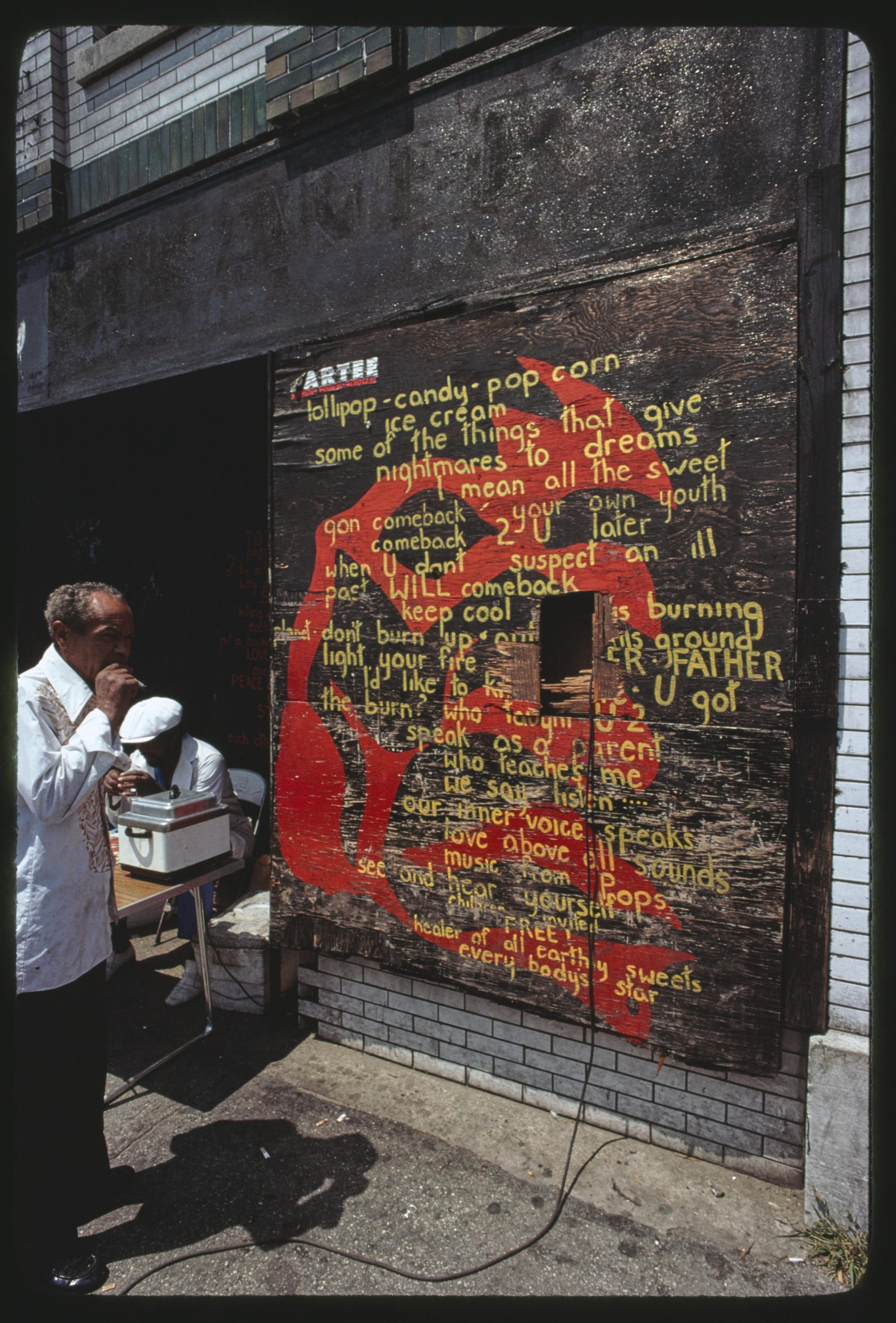 Image: Poem on Universal Alley's wall (1977). Image by Jonas Dovydenas for Chicago Ethnic Arts Project. Image courtesy of the Library of Congress.
