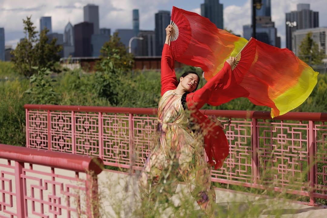 Image: Irene Hsiao dancing on the bridge. Guardians of the Earth and Sky at Ping Tom Park, August 23, 2025. Photo by Scott Shigley.