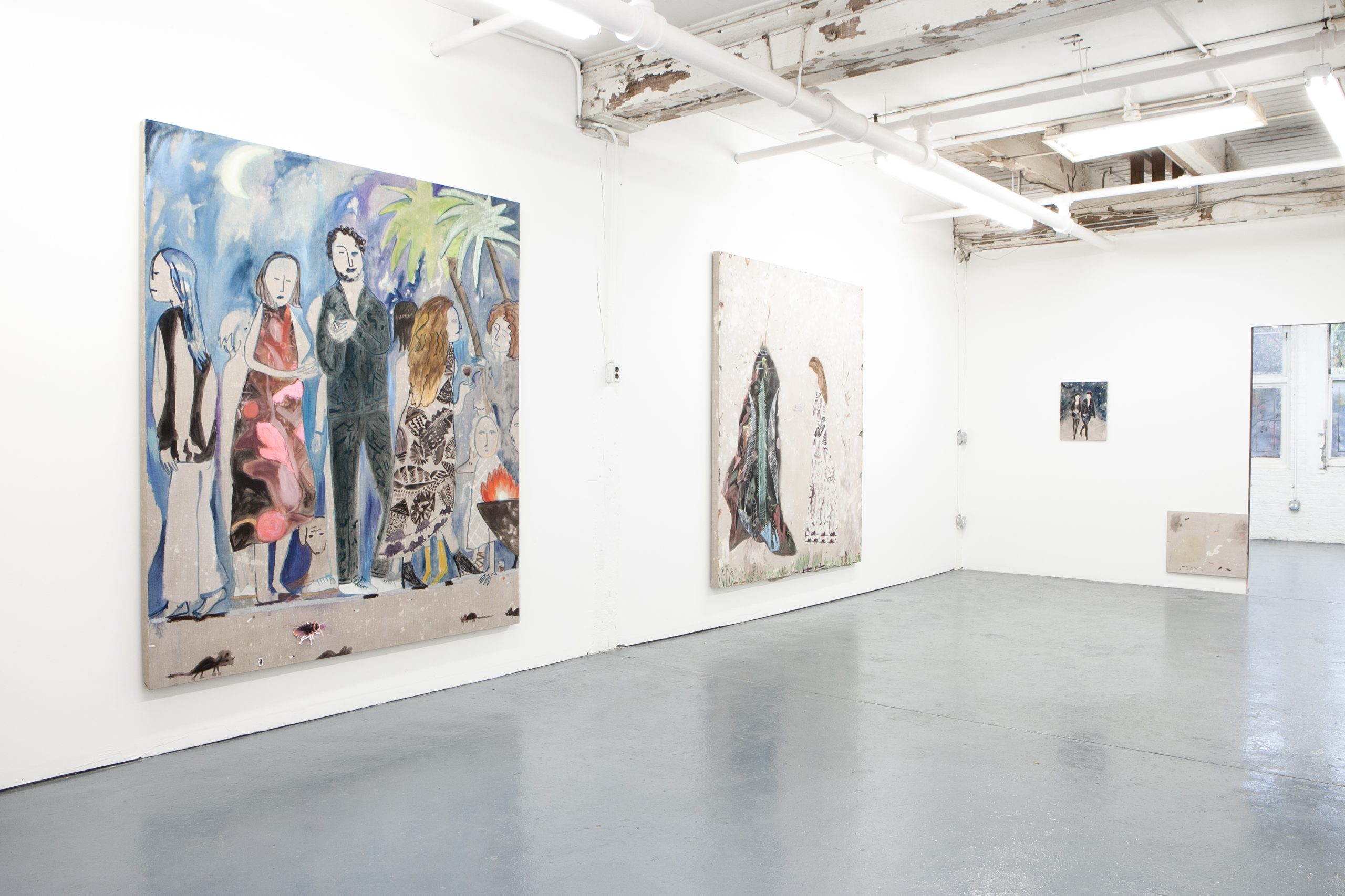Installation view, Mari Eastman: Studio Simulacrum, Goldfinch, 2017. This was the first show of the gallery. Three paintings hang on the white gallery walls. The two paintings closest to the viewer are large, nearly floor-to-ceiling pieces, that feature figures standing together against a deep blue-purple night sky. The third painting is small and hangs on the farthest wall, it is hard to see the two figures standing against a dark blue background. Courtesy of Goldfinch.