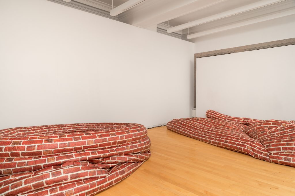 Installation view of Variations in Mass Nos. 5, 6, 7 Jacqueline Kiyomi Gork (Los Angeles, United States) showing an inflatable with brick prints. Image courtesy of Chicago Architectural Biennial.