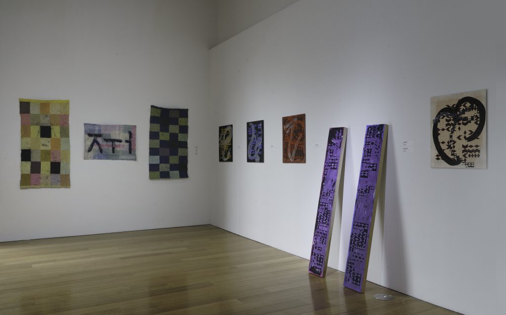Installation image of Shifting Tongues at Charlotte Street Foundation, showing work by Samantha Hann and Yangbin Park. Photo by E.G. Schempf.