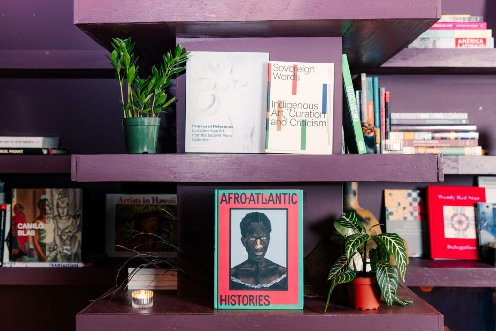 Chuquimarca's art books on view at Tala Gallery. Centered in the photograph is Frames of Reference: Latin American Art from the Jorge M Pérez Collection, Sovereign Words: Indigenous Art, Curation and Criticism, and Afro-Atlantic Histories. Photo by Steven Piper courtesy of Tala Gallery.