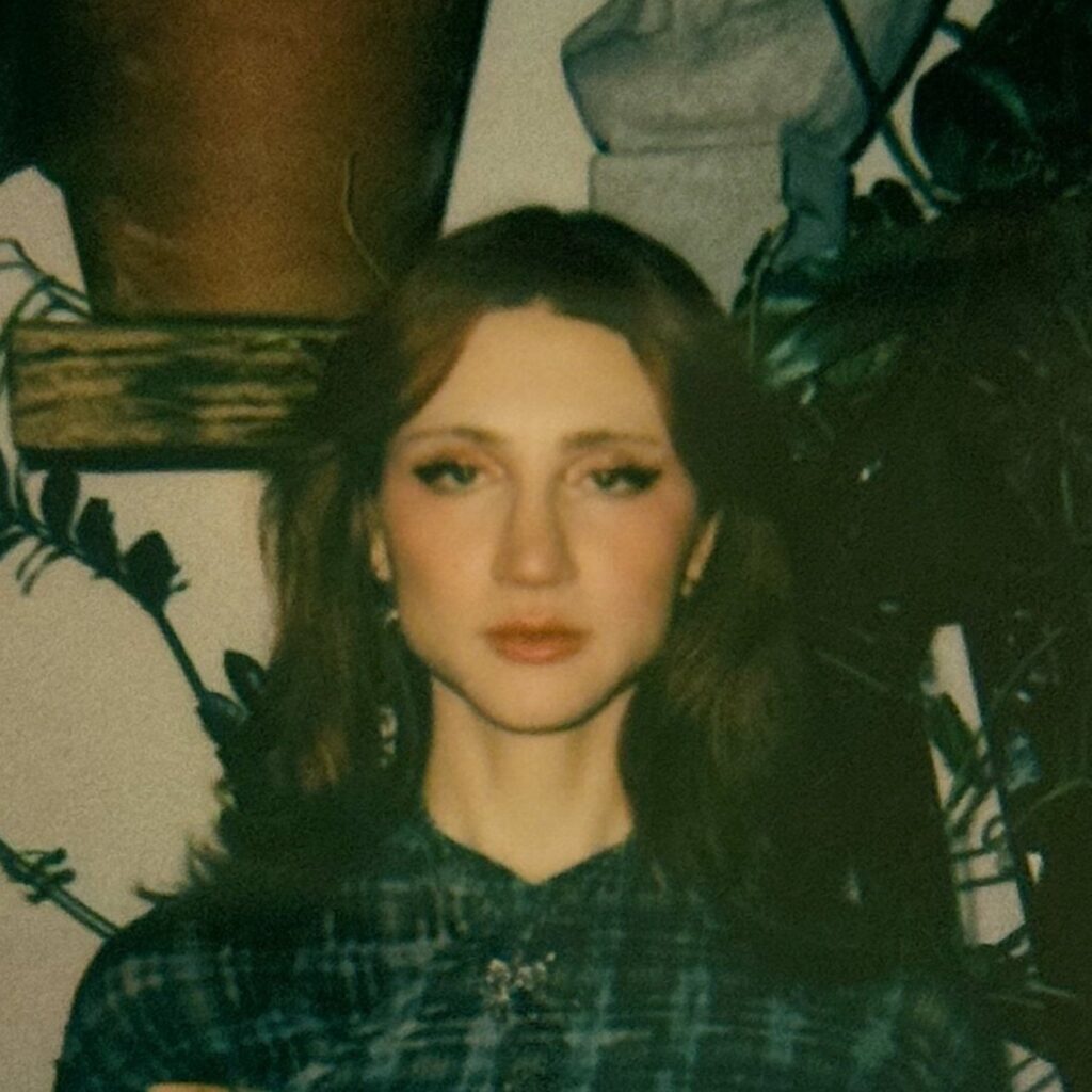 Image: Color polaroid portrait of Riley Yaxley.