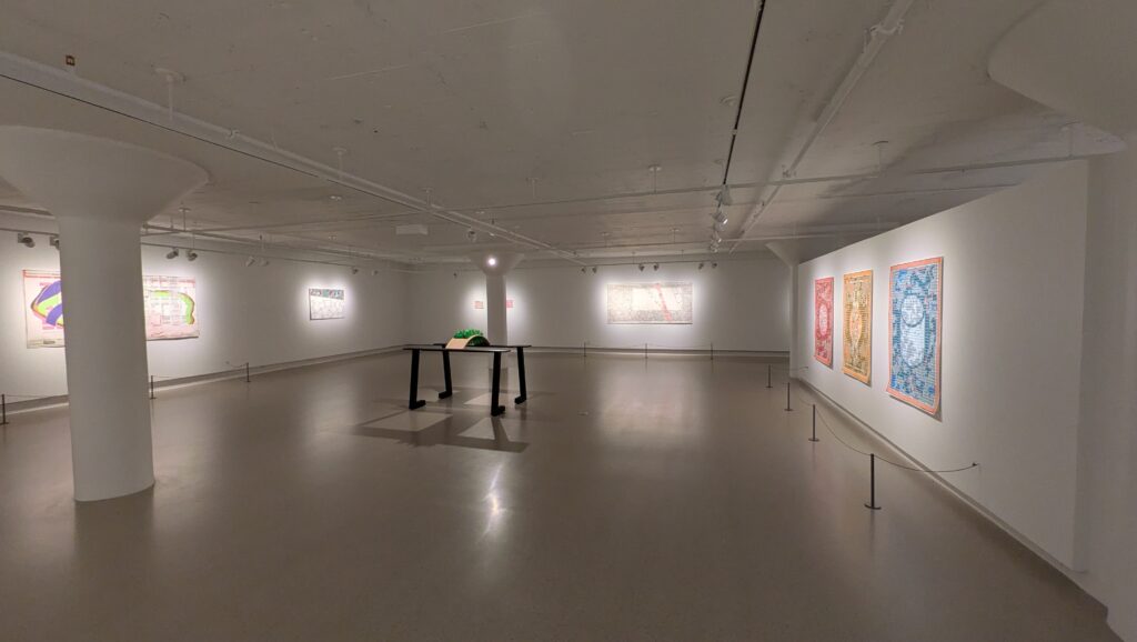 Installation photo of the exhibition BINGO! by the artist Jen Wohlner at the Neidorff Family Gallery in the Sheldon Concert Hall. The space is white with the artwork on the walls and Remember when the summers would not end (in 2026) positioned in the center of the gallery. Courtesy of the artist.