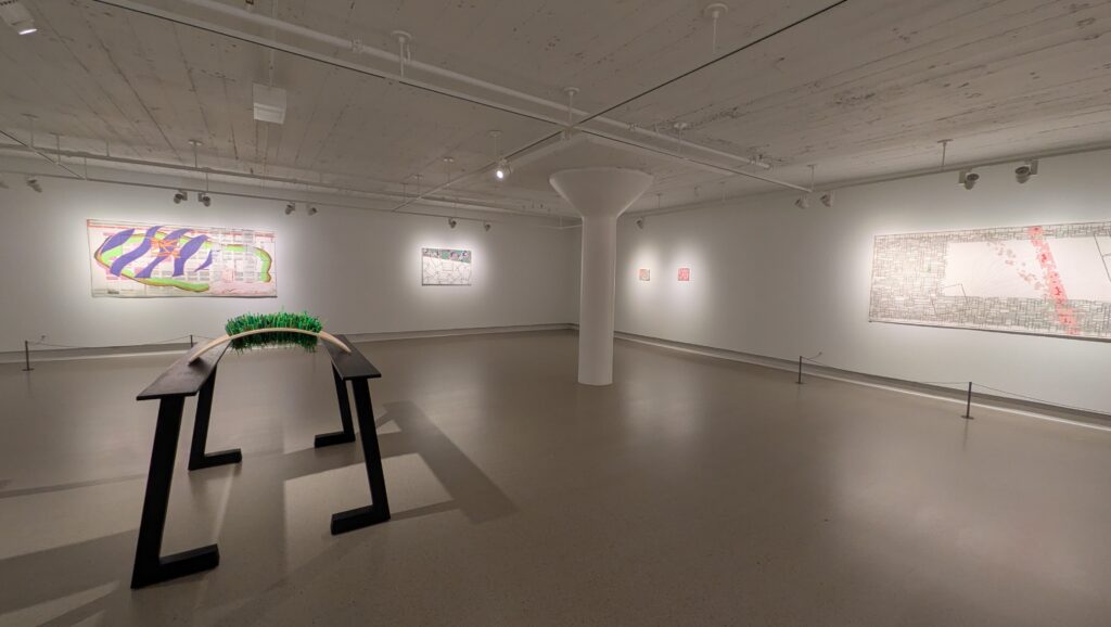 Installation photo of the exhibition BINGO! by the artist Jen Wohlner at the Neidorff Family Gallery in the Sheldon Concert Hall. The space is white with the artwork on the walls and Remember when the summers would not end (in 2026) positioned in the center of the gallery. Courtesy of the artist.