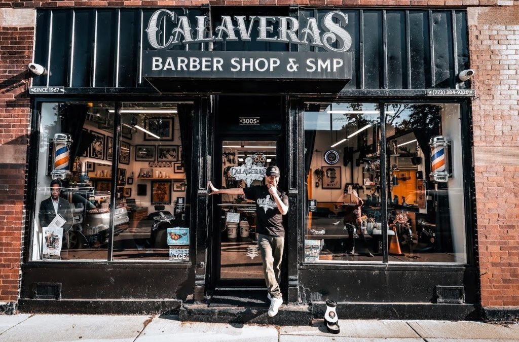 Ricardo Sepeda aka B-boy Reksick in front of his barber shop. Photo by Felix Fregoso.